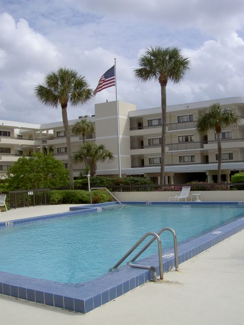 Swimming pool and building with American flag
